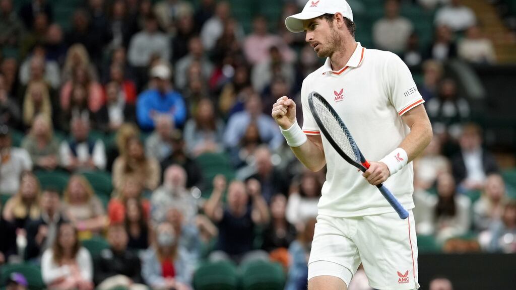 Andy Murray in action against Nikoloz Basilashvili on Centre Court on day one of Wimbledon. Photograph: John Walton/PA Wire.