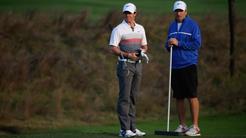 Rory McIlroy looks on with his caddie JP Fitzgerald during a Pro-Am at Lake Malaren Golf Club ahead of the Shaghai Masters. Photograph: Matthew Lewis/Bongarts/Getty Images