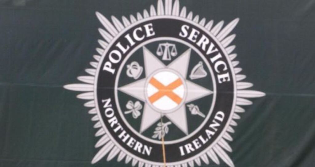 PSNI oficers have escaped injury during a gun attack in west Belfast