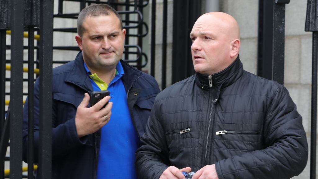 Viktor Rybakob and Tomasz Lukasz pictured leaving the Four Courts after a Circuit Civil Court action. Photograph: Collins Courts