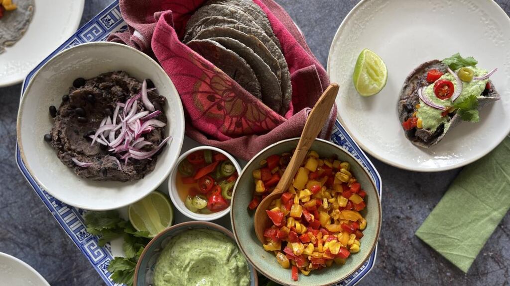Home-made corn tortillas with black beans and peppers