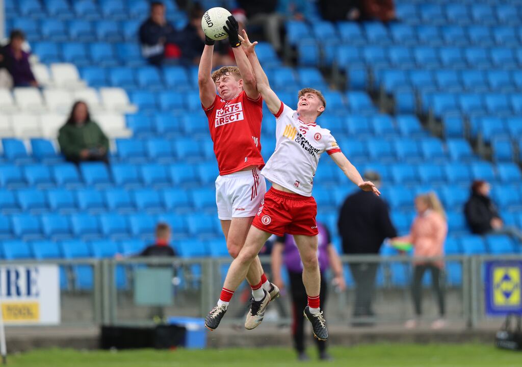 Tyrone's Cathal Farely challenges Niall O'Callaghan of Cork for a high ball during the All-Ireland MFC quarter-final at O'Moore Park, Portlaoise. Photograph: Leah Scholes/Inpho