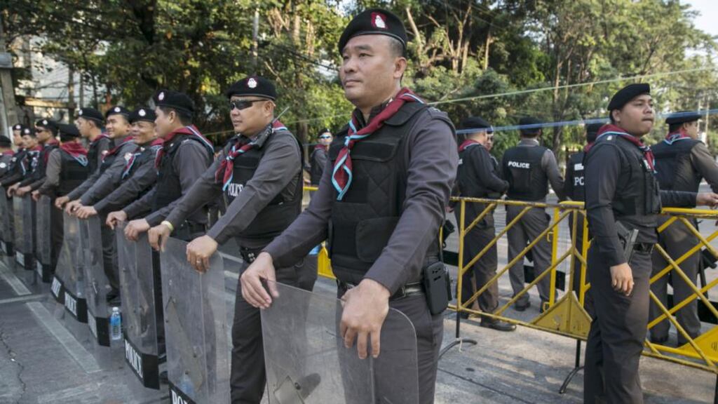 Thai military stand guard near a district office yesterday where anti-government protesters successfully stopped election material from being moved. Photograph: Paula Bronstein/Getty Images