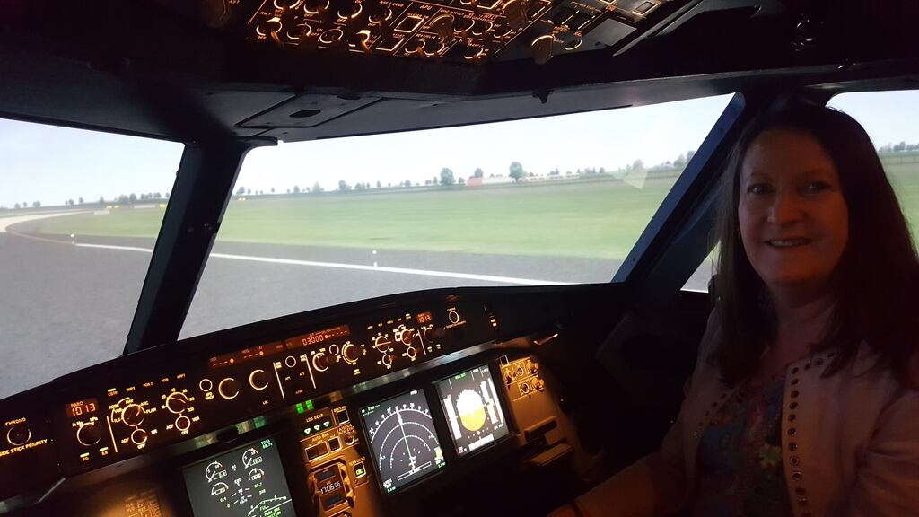 Job done: Joan Scales after she ‘landed’ an Airbus at Dublin Airport using the Aer Lingus flight training simulator