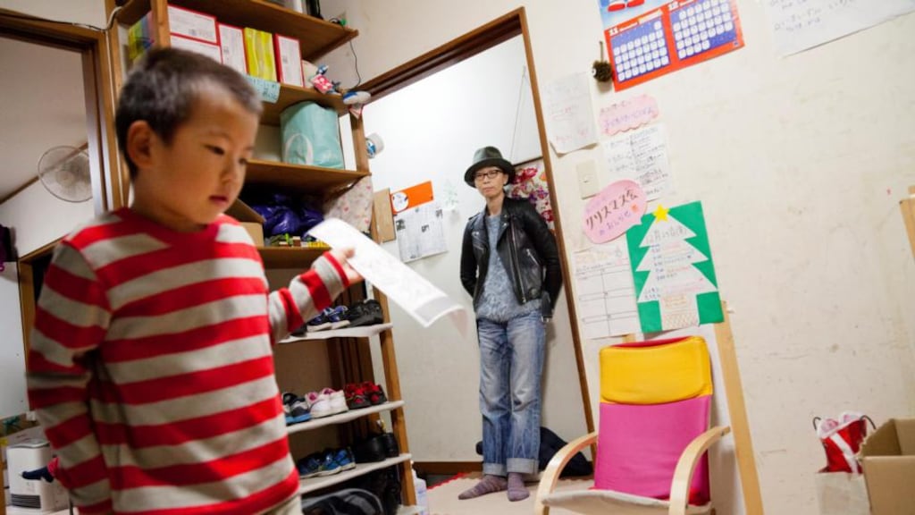 Chiaki Kitajima, an advertising executive who had to fight her bosses for support once she became pregnant, picks up two of her three sons at a school in Yokohama, Japan. Juggling work and family has long been especially difficult in Japan, but Prime Minister Shinzo Abe has pledged to do more for women like Kitajima as part of a broader effort to re-energize the economy. (Photograph: Ko Sasaki/The New York Times)
