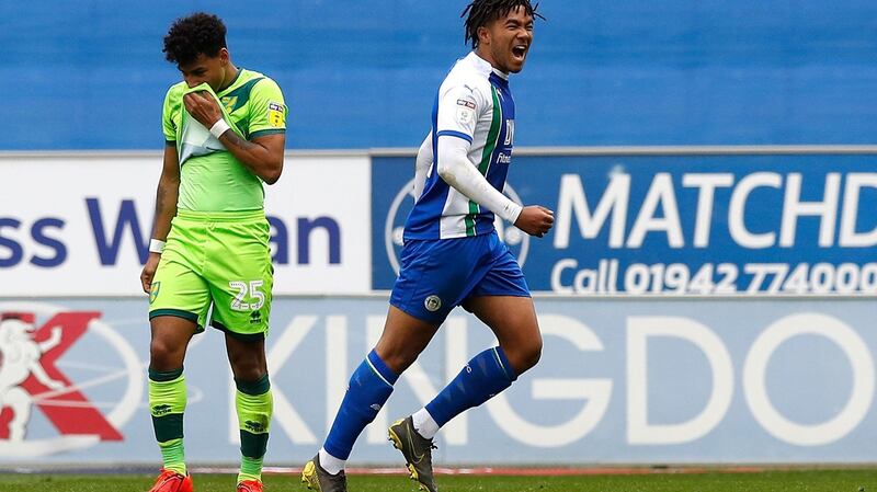 Reece James celebrates his penalty for Wigan Athletic against Norwich. Photograph: Martin Rickett/PA