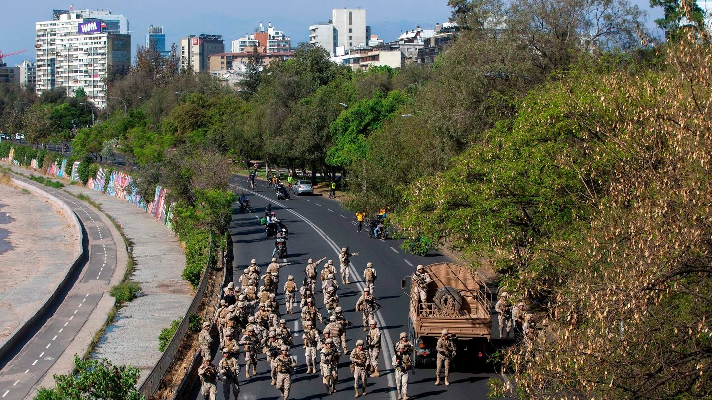 Chilean soldiers are deployed during protests in Santiago. Photograph: Claudio Reyes/ AFP/Getty