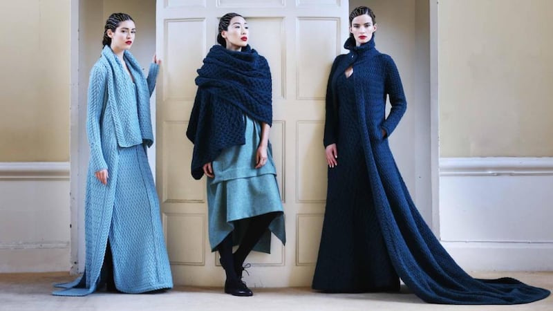 Louise wears a full-length lattice-knit coat and dress in aqua mist 100 per cent luxe merino pure wool. Yomiko wears a pinafore-style dress in tweed by Mariad Whisker for John Hanly with a throw in 100 per cent luxe merino pure wool by Irelands Eye. Karen wears a full-length cable-knit coat and dress in forest glade 100 per cent luxe merino pure wool by Irelands Eye.