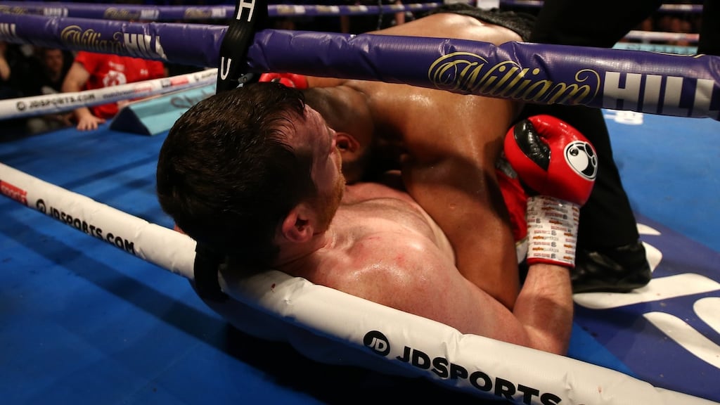 Kash Ali appears to bite David Price during their heavyweight clash in Liverpool. Photograph: Jan Kruger/Getty