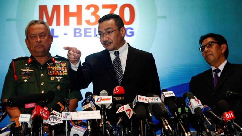 Malaysia’s acting transport minister Hishammuddin Hussein answers questions at a media briefing today, in between Chief of the Armed Forces Gen Zulkifeli Mohd Zin (left) and the Malaysian Department of Civil Aviation’s director general Azharuddin Abdul Rahmanthe on the missing Malaysia Airlines MH370 jet. Photograph: Edgar Su/Reuters
