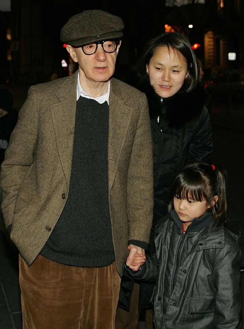 Woody Allen with his daughter Manzie and his wife Soon-Yi Previn in 2004. Photograph: Regis Duvignau/Reuters