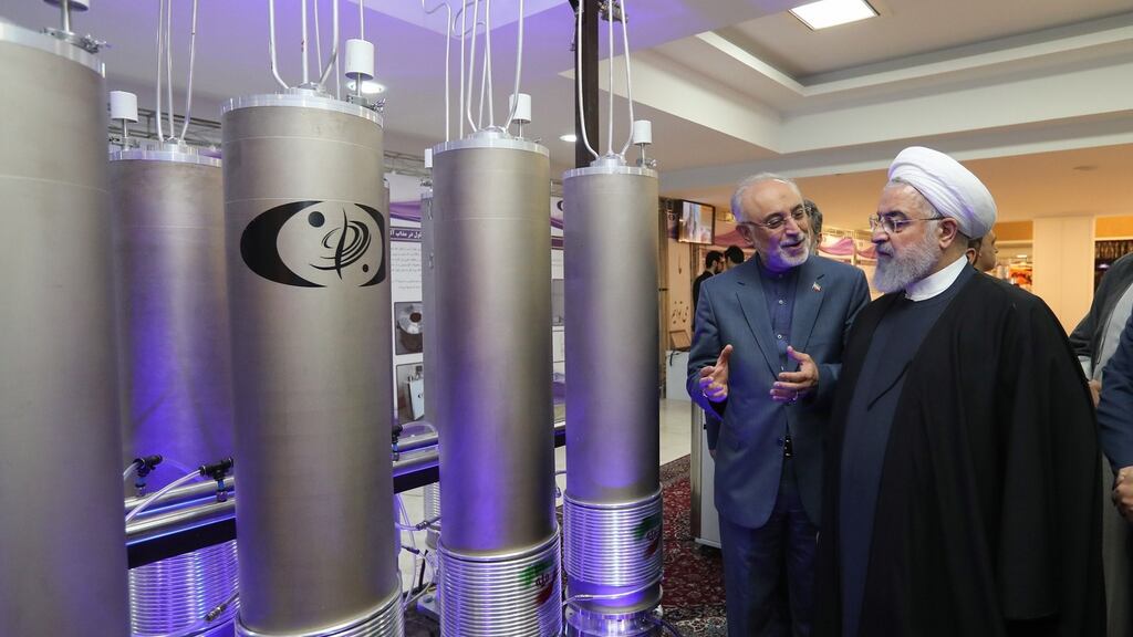 Iranian president Hassan Rouhani and the head of Iran’s nuclear technology organisation Ali Akbar Salehi inspecting nuclear technology on the occasion of Iran National Nuclear Technology Day in Tehran last month. Photograph: EPA/Iranian Presidency Office