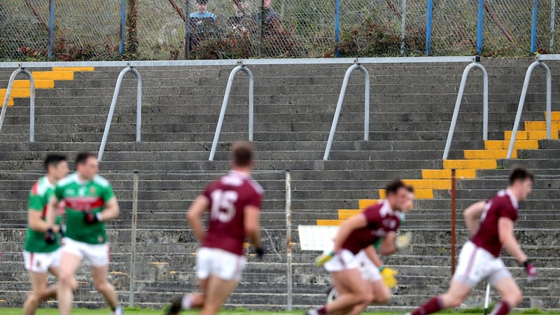 Supporters watch Mayo’s win over Galway in Tuam from outside the stadium. Photograph: Bryan Keane/Inpho
