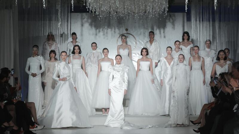 A wedding dress fashion show in Istanbul featuring designs by Ozlem Suer er. Photograph: Ozan Guzelce/Dia Images via Getty Images
