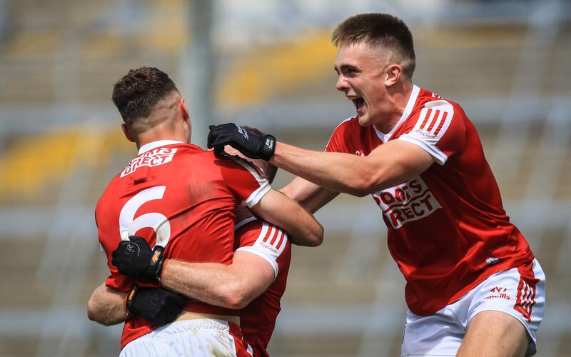 Cork's Mattie Taylor celebrates with Daniel O'Mahony and Tommy Walsh after the victory over Mayo at the TUS Gaelic Grounds, Limerick. Photograph: Evan Treacy/Inpho