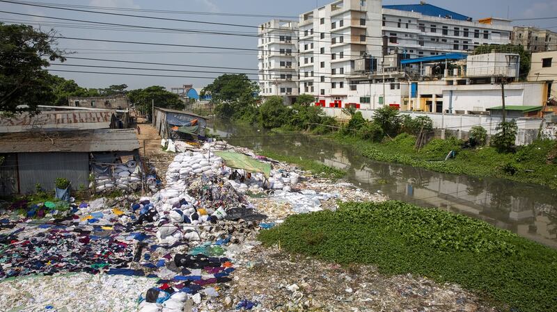 Environmental pollution on the river banks surrounding some of the textile industry buildings of Savar Upazila in Dhaka, Bangladesh. Photograph: Getty Images