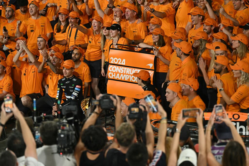 The McLaren team celebrate after winning the constructor's championship following the Abu Dhabi GP. Photograph: Andrej Isakovic/AFP via Getty Images