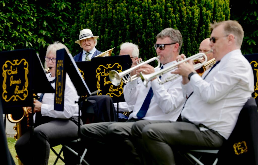 Make some noise: President Michael D Higgins at a garden party for community groups in Áras an Uachtaráin on Wednesday. Photograph: Maxwells