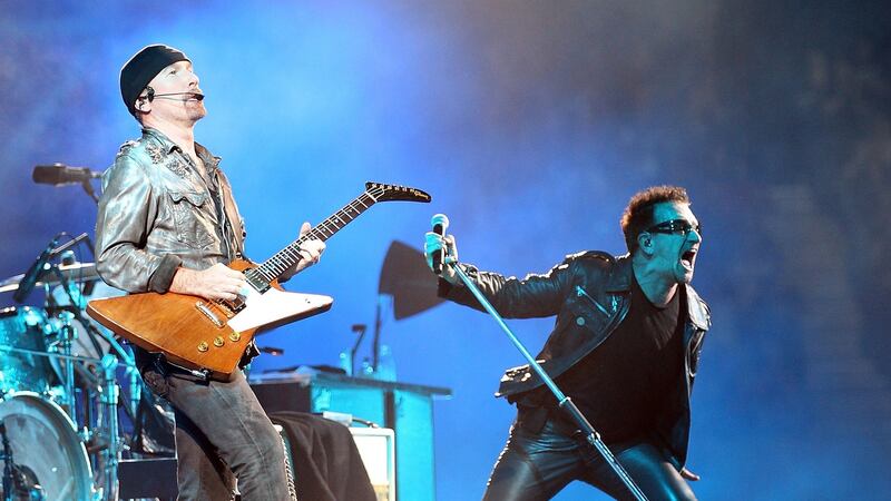 The Edge on stage with Bono: The U2 guitarist is investing in a company that wants to “disrupt” the ticket-booking industry. Photograph: Mark Metcalfe/Getty Images