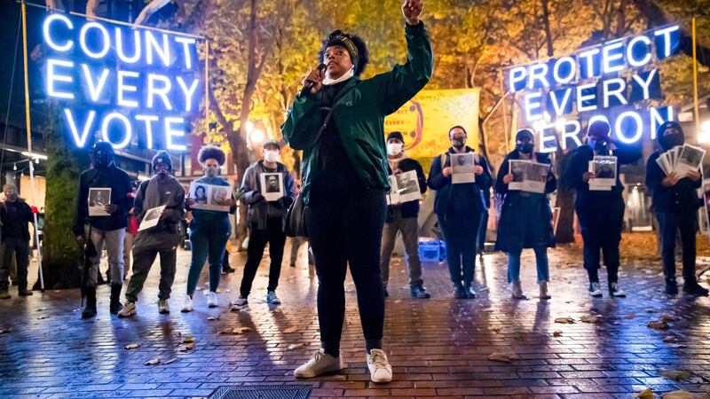 Travonna Thompson-Wiley, with the Black Action Coalition, speaks at the Count Every Vote – Protect Every Person rally and march in Occidental Park in Seattle, Washington on Wednesday. Photograph: Erika Schultz/Seattle Times via AP