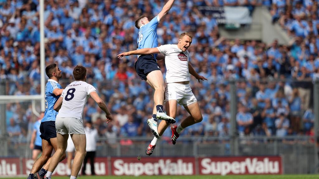 Dublin’s Brian Fenton battles with Tommy Moolick of Kildare during yesterday’s Leinster senior football final at Croke Park. Photograph: Tommy dickson/Inpho