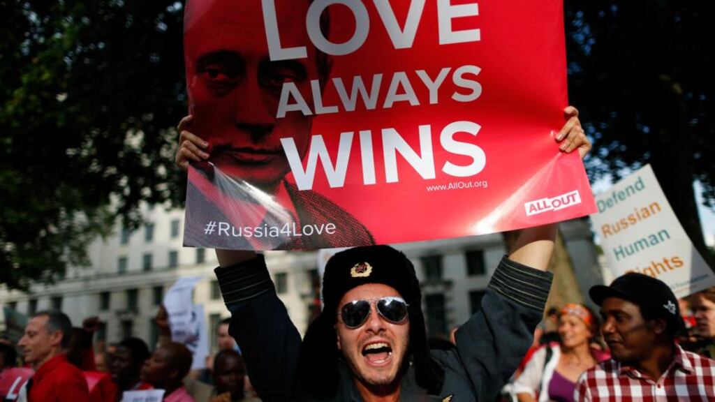 A protester holds up a placard during a demonstration against Russia’s anti-gay legislation near  Downing Street in London. Photograph: Andrew Winning/Reuters