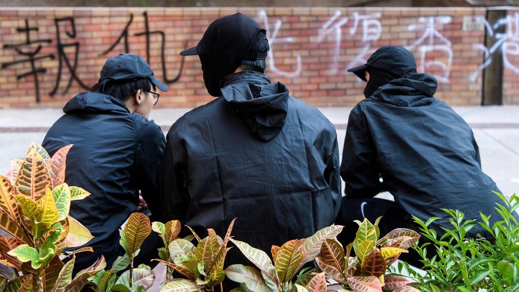Protesters sit in an open area at the campus of the Hong Kong Polytechnic University in the Hung Hom district of Hong Kong on Wednesday. Photograph: Anthony Wallace/AFP via Getty Images