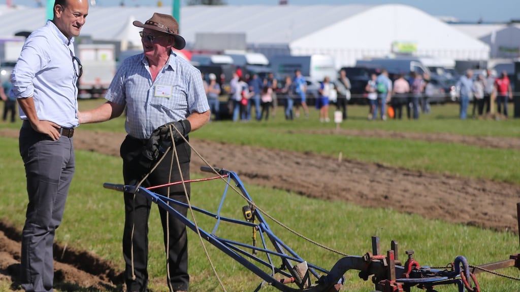 Taoiseach Leo Varadkar tries his hand at ploughing with Colman Cogan  from Sligo during the National Ploughing Championships in Carlow, Ireland. Photograph:  Niall Carson/PA Wire