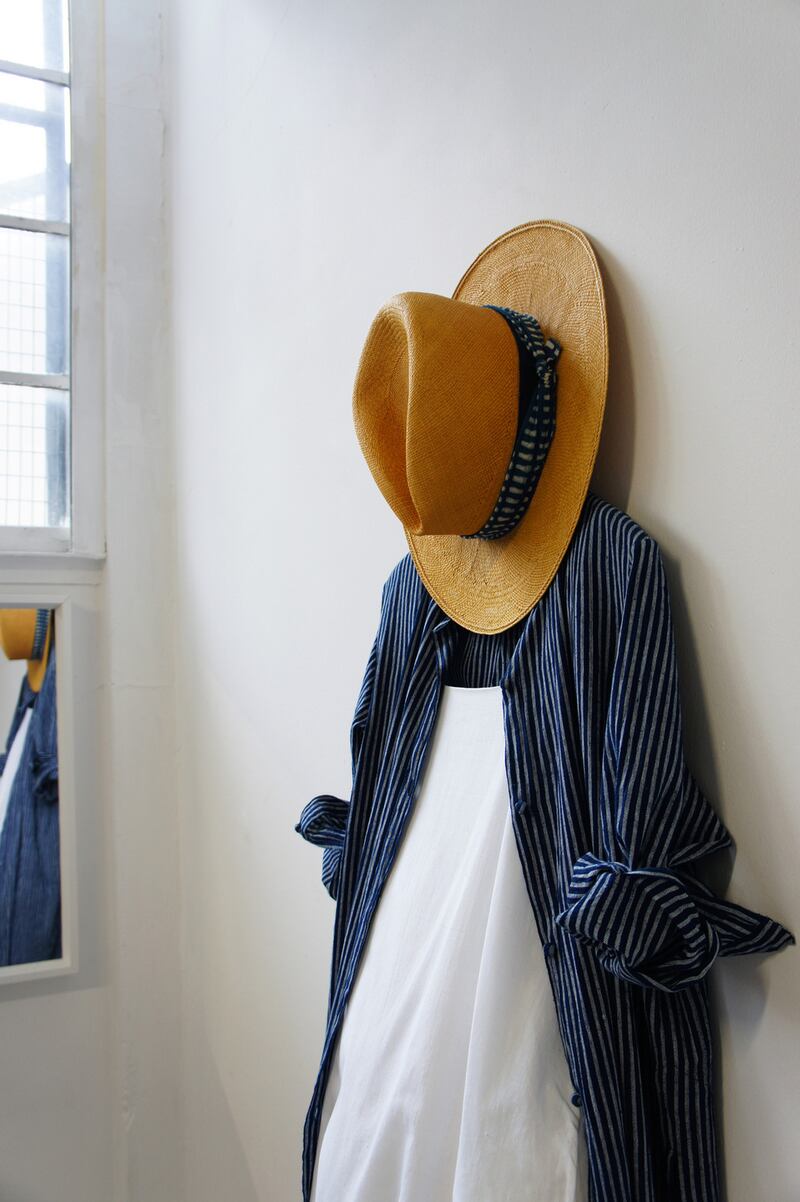 Striped indigo long shirt €380, white slip dress €310, Herbert mustard panama hat €239.