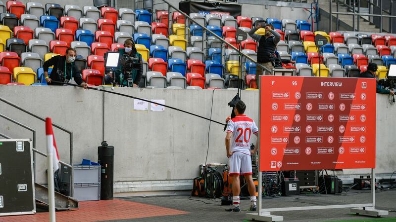 Journalists speak to Fortuna Duesseldorf’s Steven Skrzybski after their game against Paderborn. Photo: Sascha Schuermann/AFP via Getty Images
