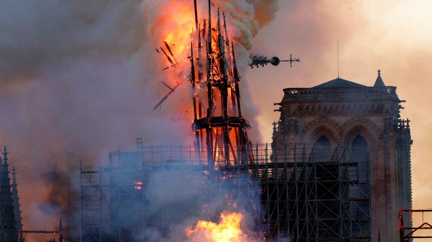 The steeple collapses as smoke and flames engulf the Notre Dame Cathedral in Paris. Photograph: Getty