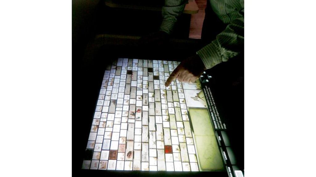 A table-top touchscreen uses interactive Microsoft Surface technology to view collections at the Discover Your National Library exhibition on Dublin's Kildare Street.