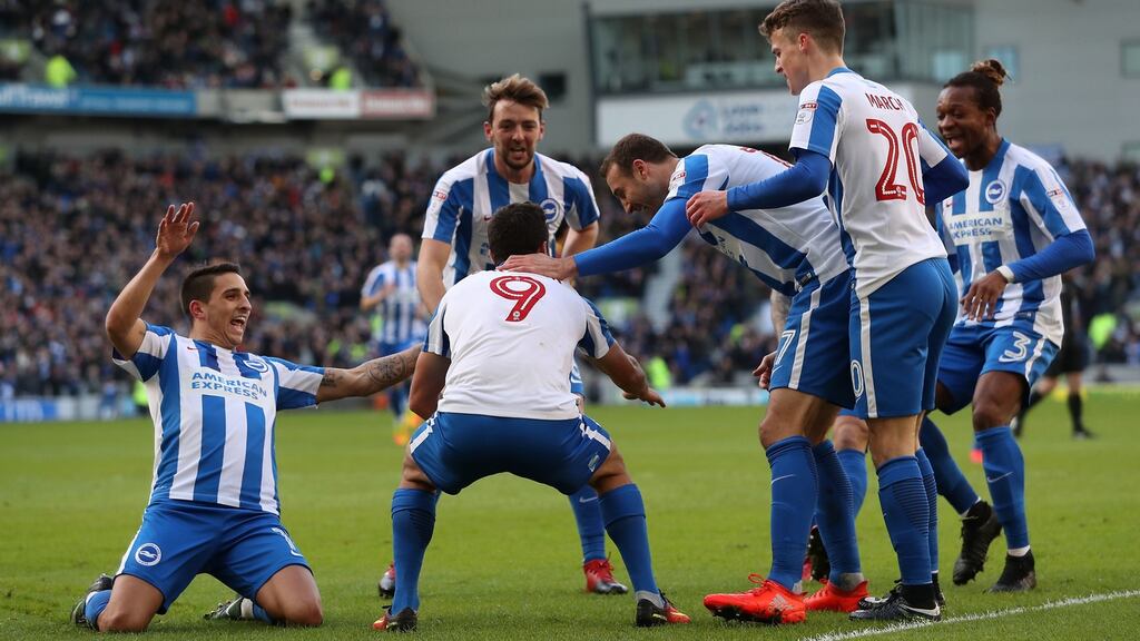 Brighton and Hove Albion’s Sam Baldock celebrates with teammates at the Amex Stadium. Photograph: PA