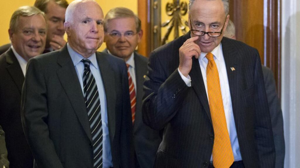 Members of the US Senate’s bipartisan “Gang of Eight” who crafted the immigration reform bill as they left the floor of the senate in Washington.