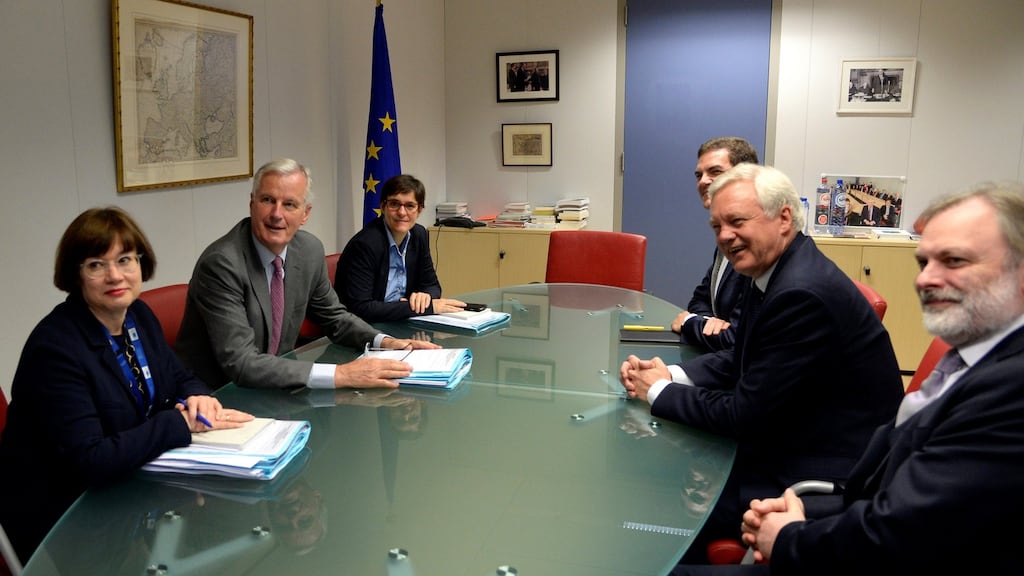European Union’s chief Brexit negotiator Michel Barnier and his delegation with their briefing papers sit across from Britain’s Secretary of State for Exiting the European Union David Davis and his delegation at the talks on Brexit. Photograph: Reuters