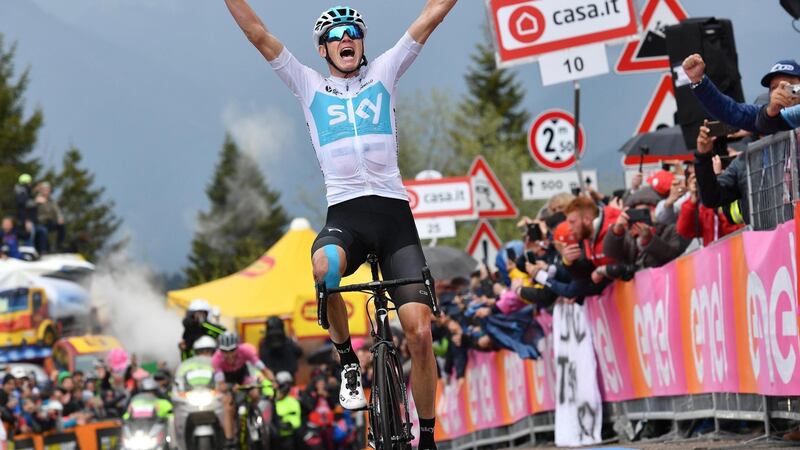 Froome celebrates as he crosses the finish line to win the 14th stage. Photo: Daniel Dal Zennaro/EPA