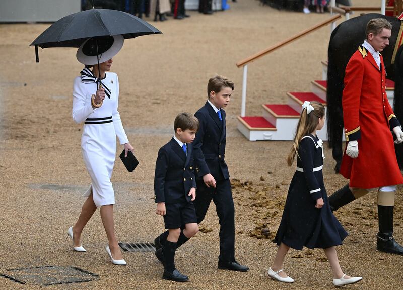 Catherine, Princess of Wales, walks with her children George Charlotte of and Prince Louis. Photograph: Justin Tallis/AFP/Getty Images