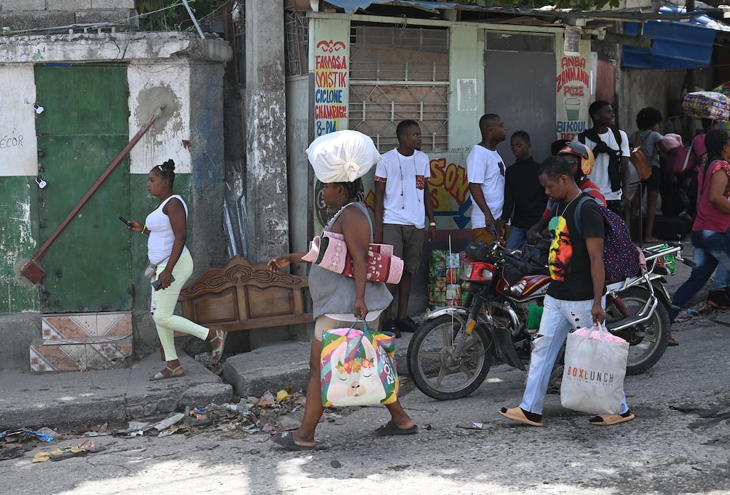 Resident evacuate the Carrefour Feuilles commune in Port-au-Prince, Haiti as gang violence continues. Photograph: Richard Pierrin/AFP/Getty Images