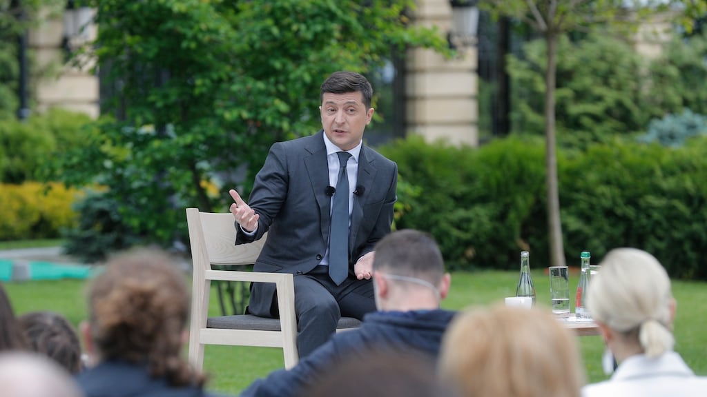 Ukrainian president Volodymyr Zelensky talking to socially distanced journalists in a Kiev park near the presidential administration on Wednesday. Photograph: Sergey Dolzhenko/EPA