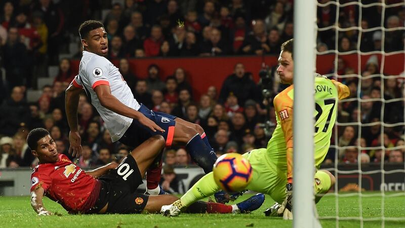 Rashford slides in to score United’s third. Photo: Paul Ellis/AFP