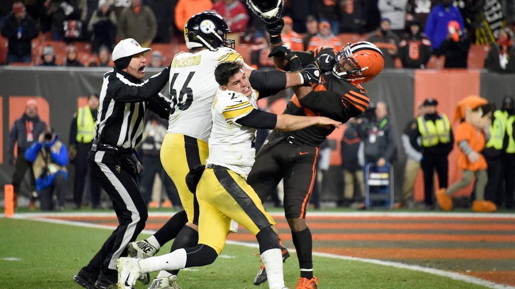 Myles Garrett (R) of the Cleveland Browns hits the Pittsburgh Steelers’ Mason Rudolph with his own helmet. Photograph:Jason Miller/Getty