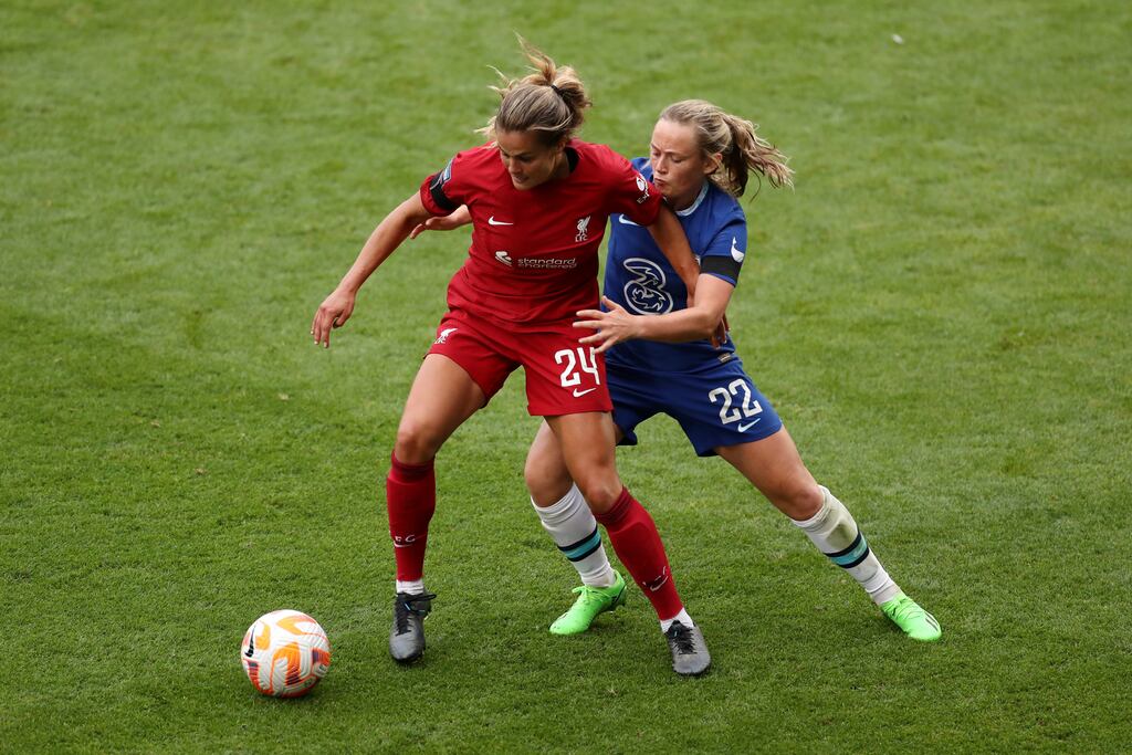 Katie Stengel of Liverpool battles for possession with Erin Cuthbert of Chelsea. Photograph: Lewis Storey/Getty