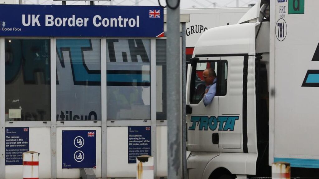 A lorry passes through UK Border Control at the Eurotunnel site in Calais. Ferry services have reopened following a fresh blockade at the port. Photograph: Gareth Fuller/PA Wire