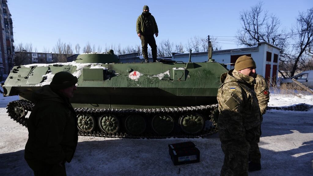 Ukrainian medical servicemen stand on an armoured personnel carrier after they carried wounded servicemen to hospital in the Ukraine-controlled town of Avdiivka in Donetsk region on January 30th. Photograph: Aleksey Filippov/AFP/Getty