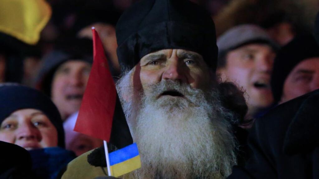 A Ukrainian monk chants slogans during a rally at the central Independence square in Kiev, Ukraine, on Monday, December 2nd. Photograph: AP Photo/Sergei Grits