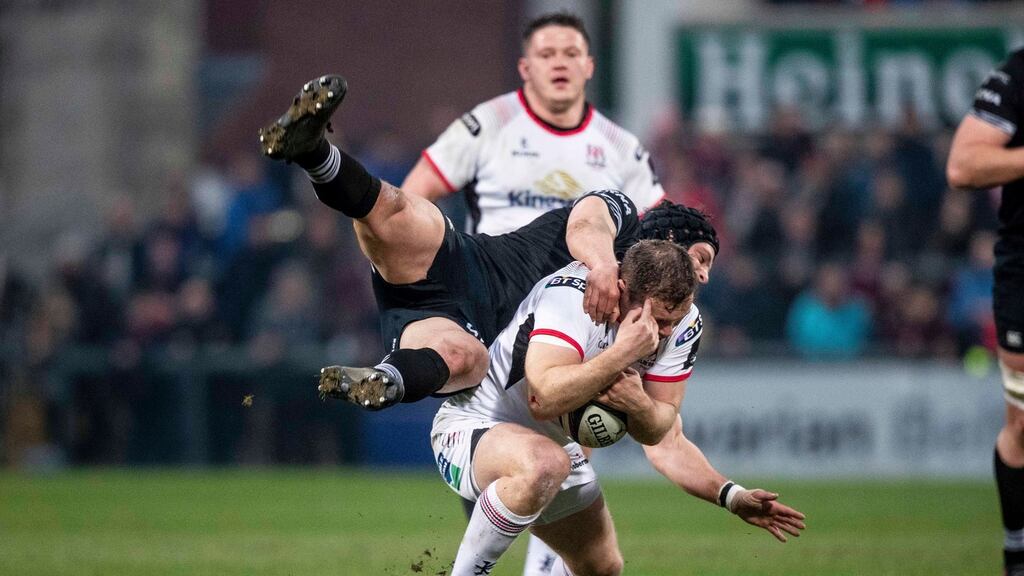 Ulster’s Darren Cave is tackled by Dan Evans of Ospreys during their Pro14 clash at Kingspan Stadium. Photo: Morgan Treacy/Inpho