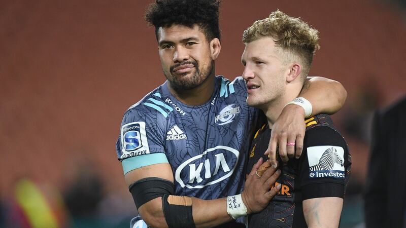 Ardie Savea consoles Damian McKenzie after the Hurricanes beat Warren Gatland’s Chiefs. Photograph: Jeremy Ward/Inpho