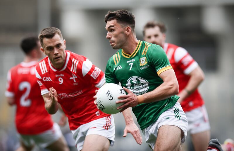 Meath's Ciarán Caulfield is challenged by Louth's Andy McDonnell. Photograph: Tom Maher/Inpho