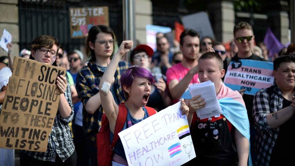 Ollie Bell (centre) joined other groups supporting The Is Me, Transgender Healthcare, a protest at Government Buildings and Leinster House about access to healthcare for transgender people. Photograph: Dara Mac Dónaill/The Irish Times