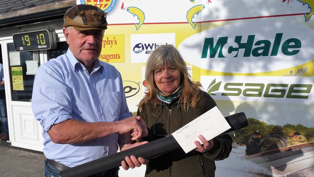 Best lady angler, Mary Miller, receiving her prize from committee president, Joe Cusack